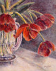 Vase with red tulips near the end of their beauty on a textured canvas